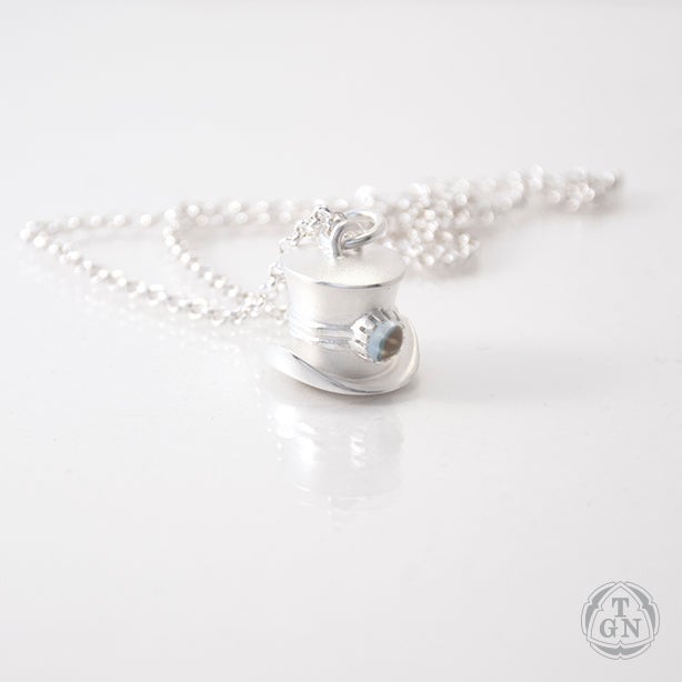 Juhani Ananin: The Toppest hat (pendant with topaz)
